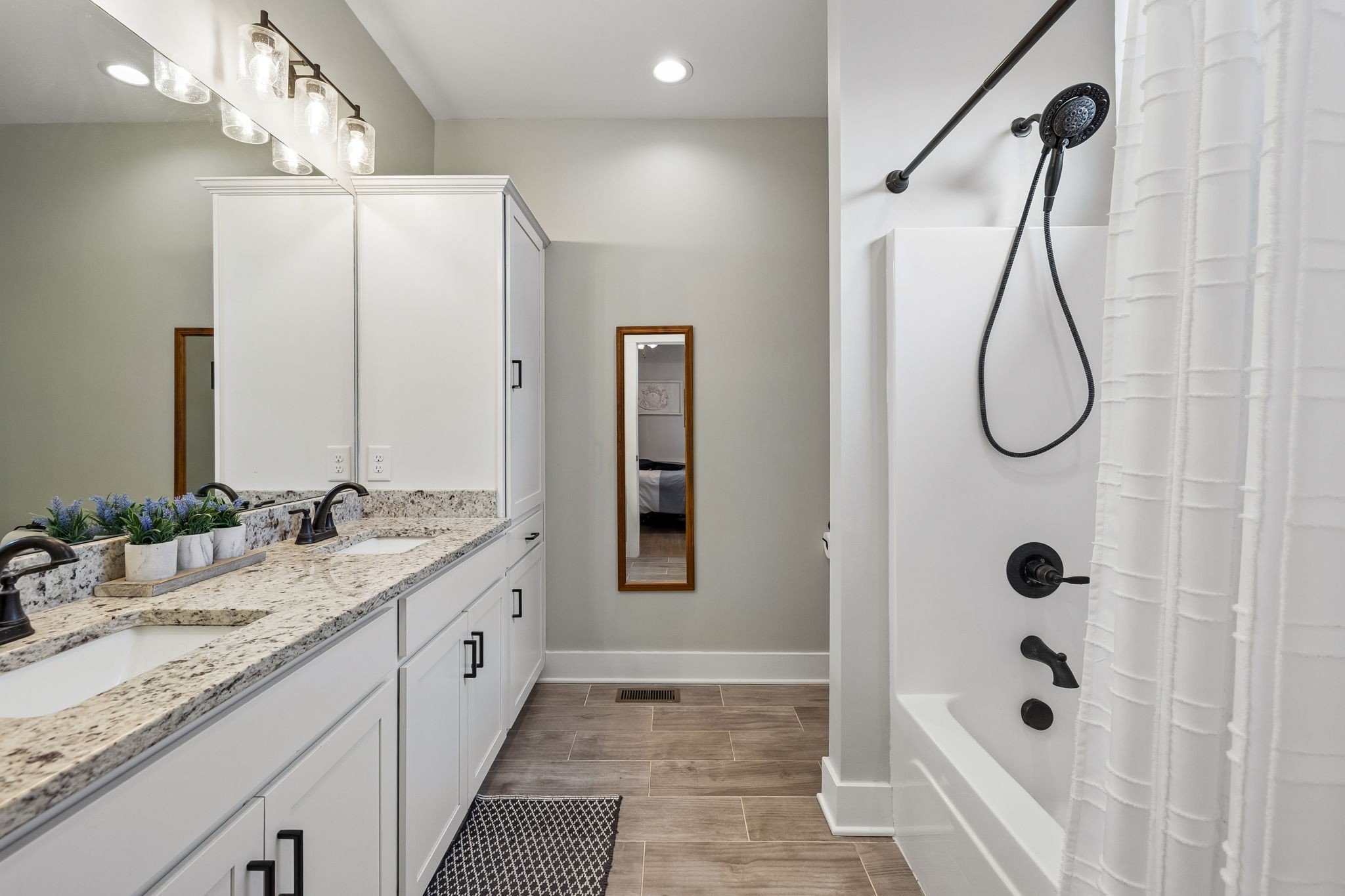 126 Julia Ann Court Springfield, TN 37172 - Photo 25 of 37 a bathroom with a granite countertop sink and a mirror