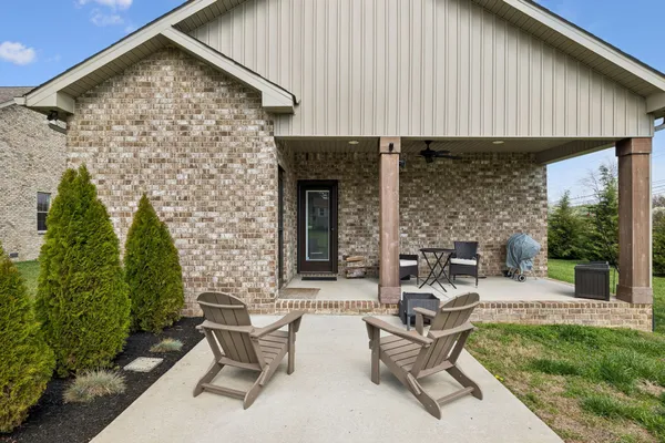 a view of a patio with a table and chairs in patio