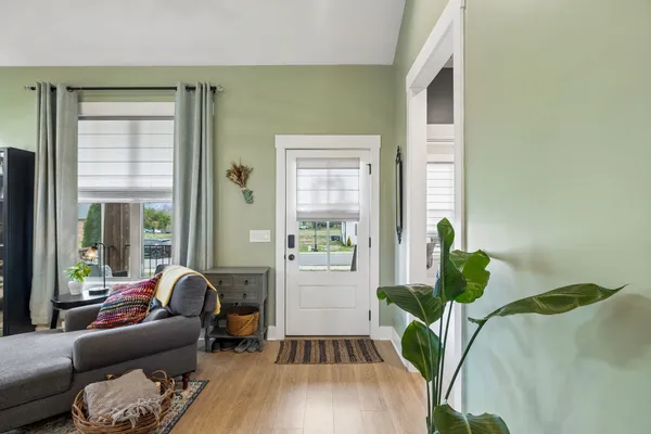 a living room with furniture and a potted plant