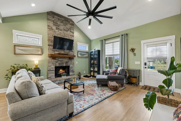 a living room with furniture and a fireplace