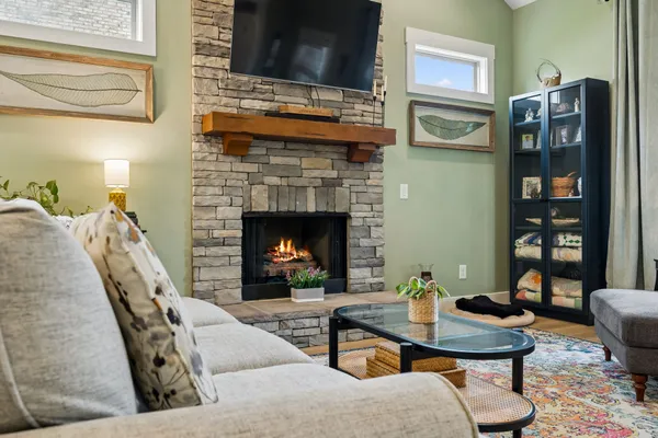 a living room with furniture and a fireplace