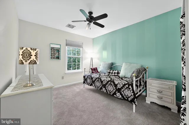 a bed room with a bed and a window