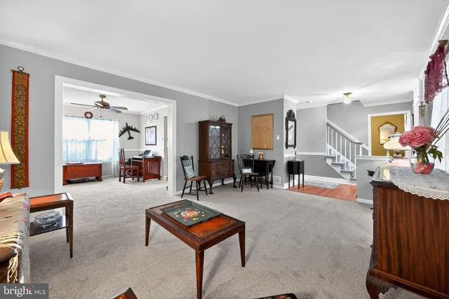 a living room with furniture and a table