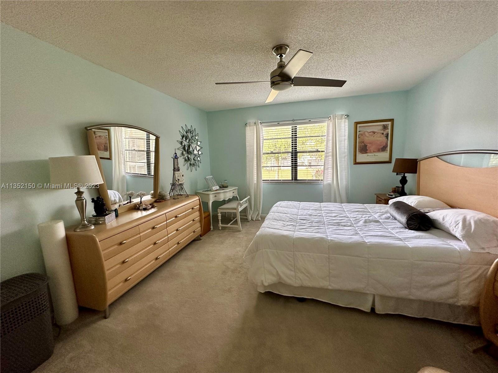 250 Gate Road, Unit 258 Hollywood, FL 33024 - Photo 14 of 30 a bedroom with a bed and window