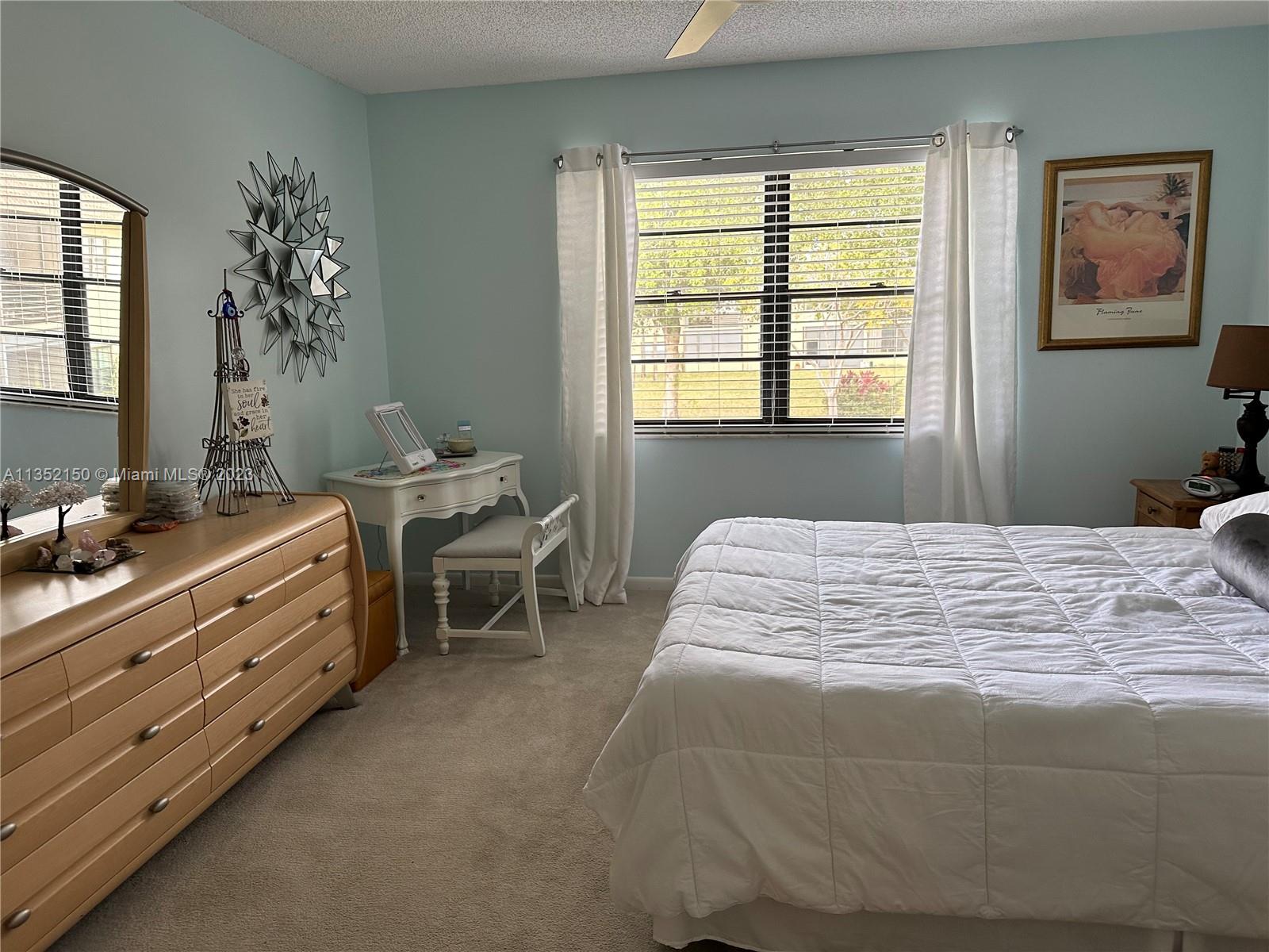 250 Gate Road, Unit 258 Hollywood, FL 33024 - Photo 15 of 30 a bedroom with a bed and a window