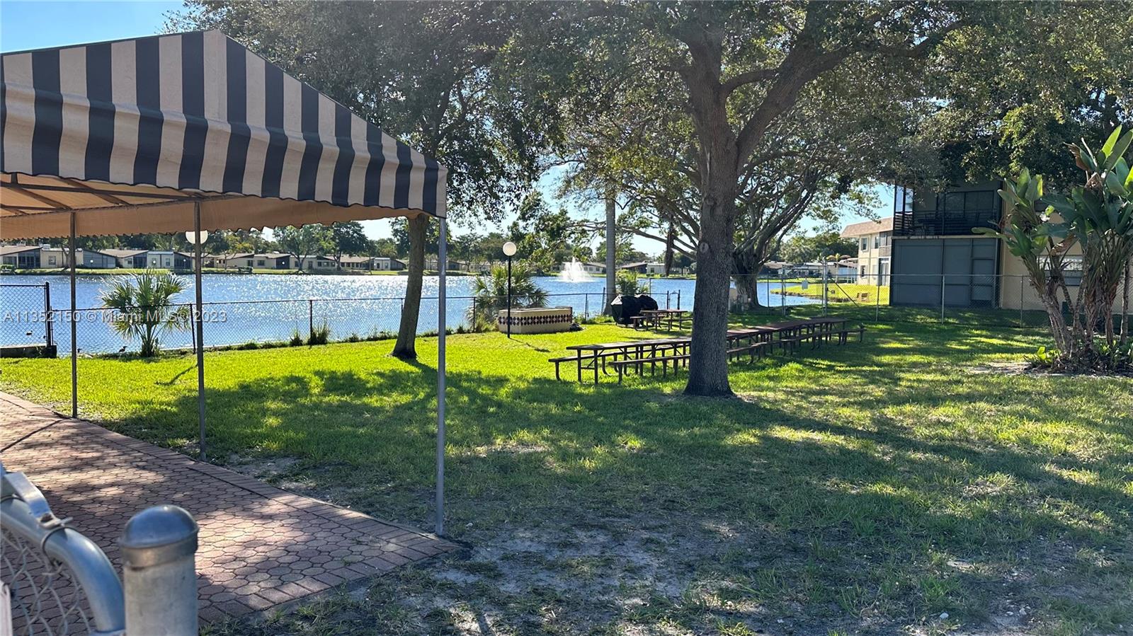 250 Gate Road, Unit 258 Hollywood, FL 33024 - Photo 18 of 30 a view of a park with large trees