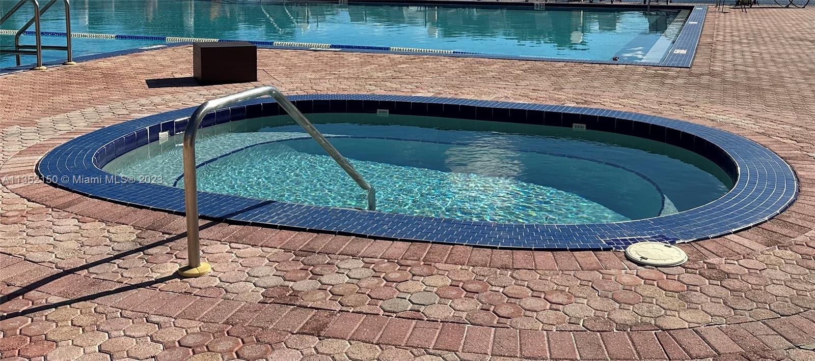 250 Gate Road, Unit 258 Hollywood, FL 33024 - Photo 21 of 30 a view of swimming pool with a outdoor seating