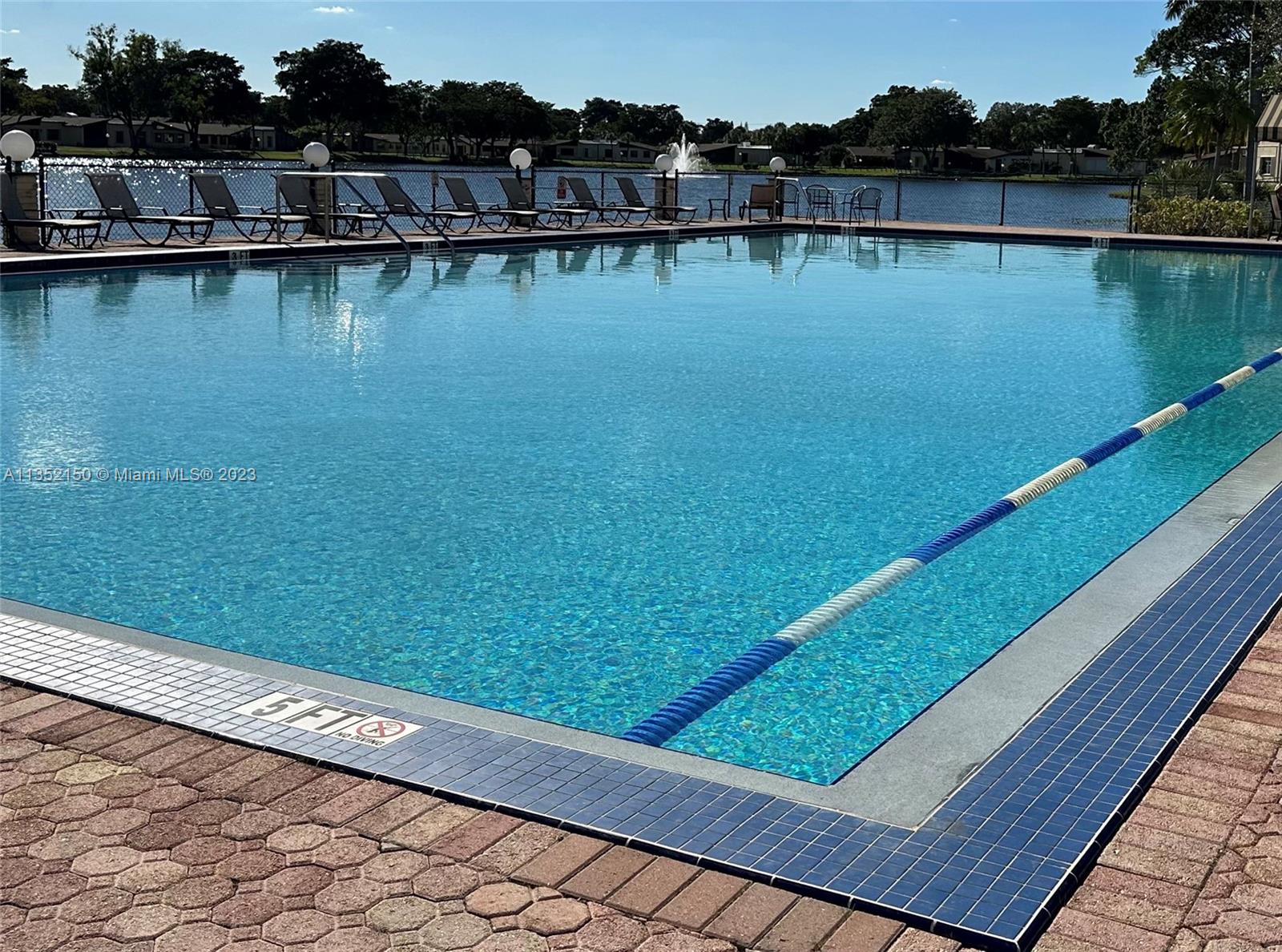 250 Gate Road, Unit 258 Hollywood, FL 33024 - Photo 22 of 30 a view of a lake with houses in the back