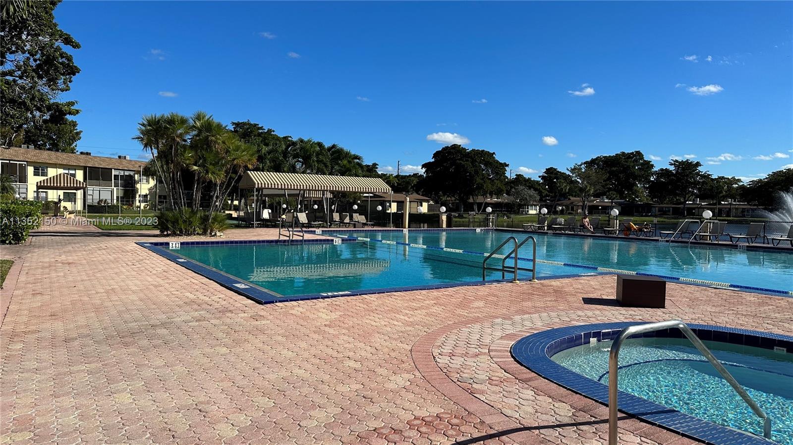250 Gate Road, Unit 258 Hollywood, FL 33024 - Photo 23 of 30 a view of swimming pool with a yard