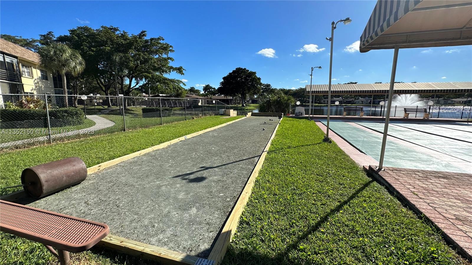 250 Gate Road, Unit 258 Hollywood, FL 33024 - Photo 24 of 30 a view of a yard with a patio