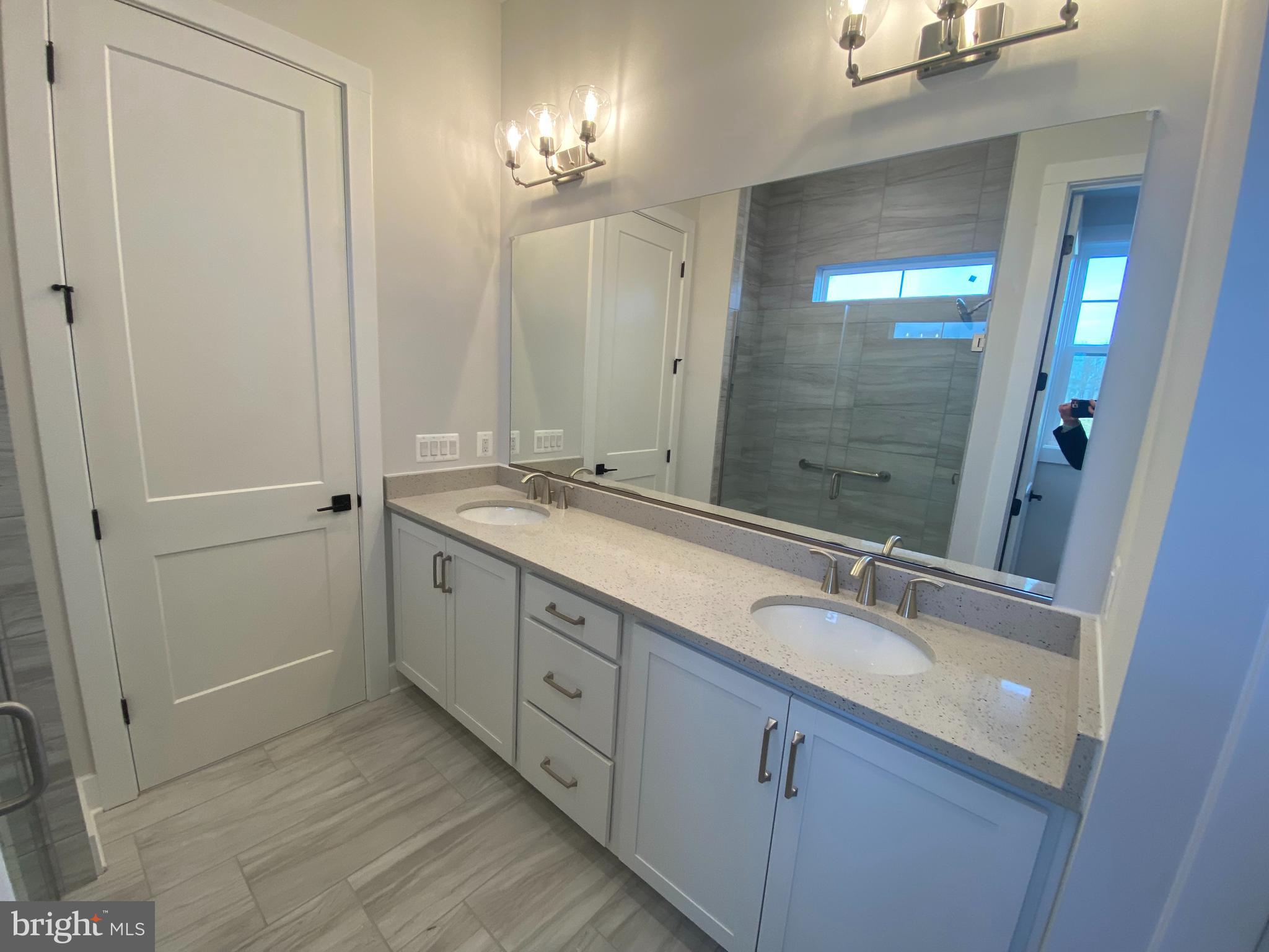 53 Gentle Slope Way Gettysburg, PA 17325 - Photo 17 of 29 a bathroom with a double vanity sink and a mirror