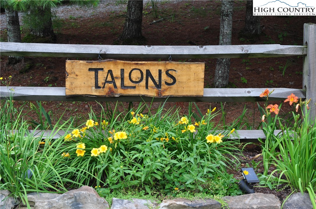 Lot 3 Sec 11 Talons Drive Boone, NC 28607 - Photo 4 of 18 a sign that is sitting in front of flowers