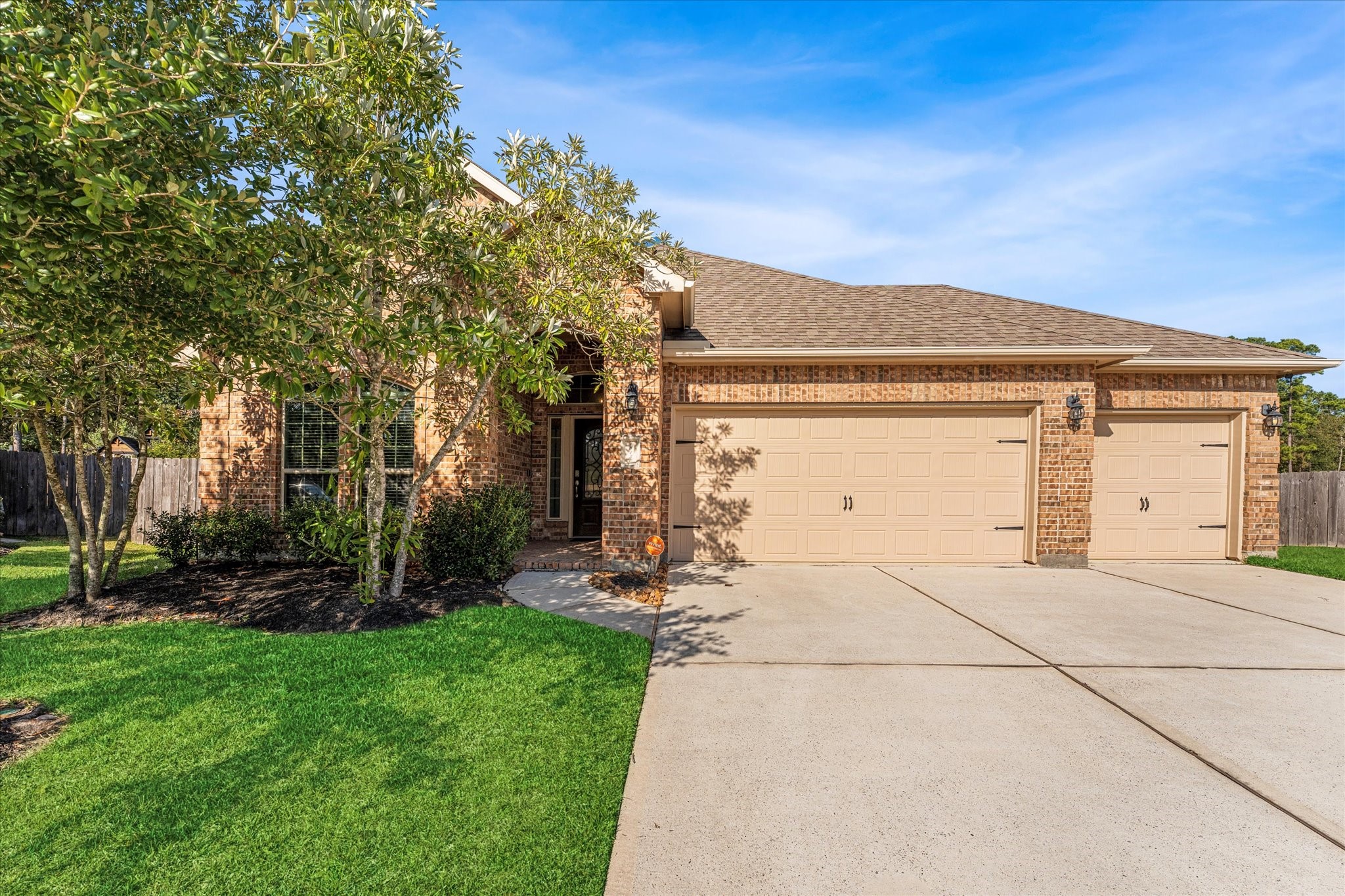 18130 Millau Viaduct Way Houston, TX 77044 - Photo 1 of 50 a view of a house with backyard and a tree