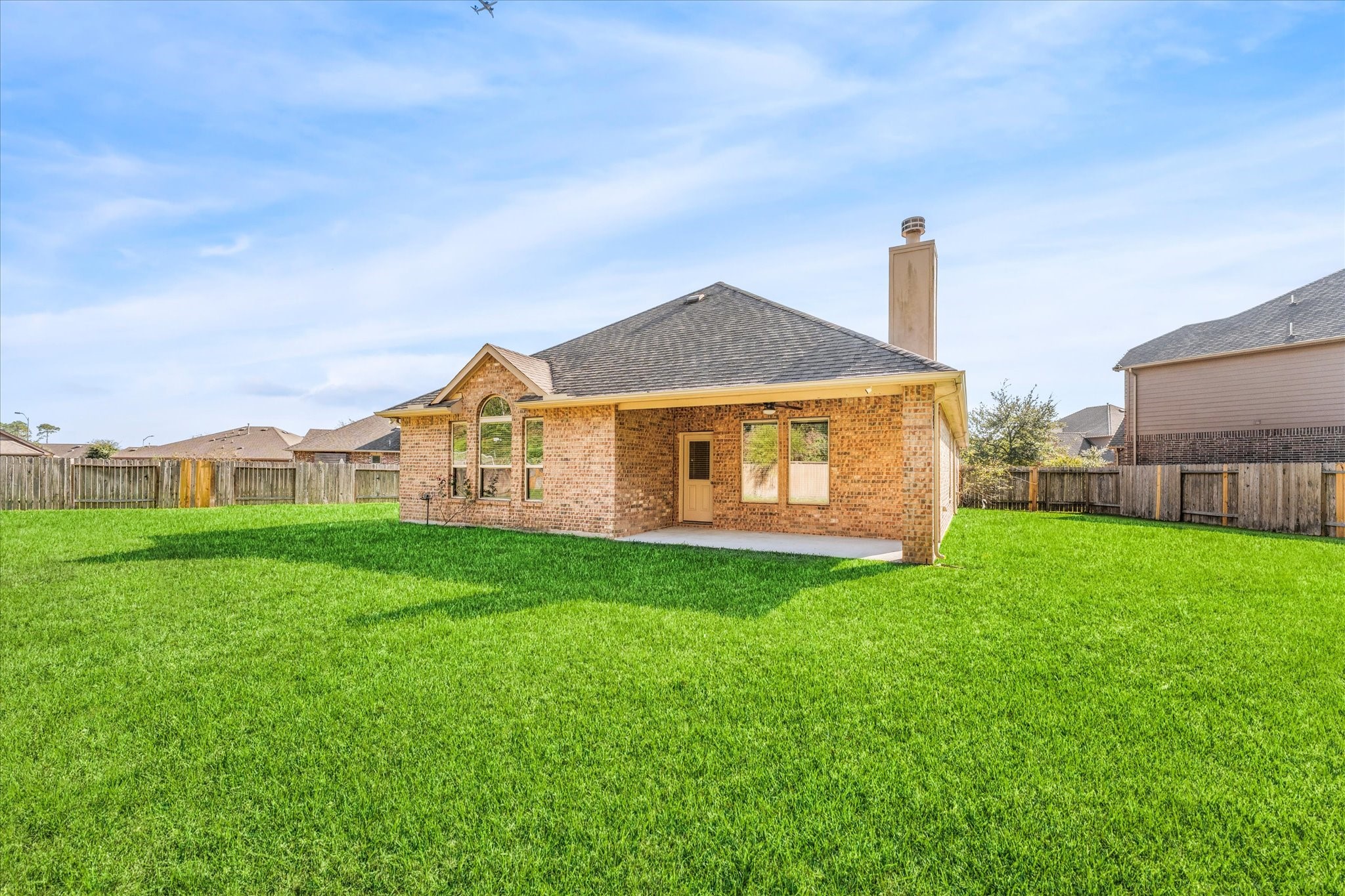 18130 Millau Viaduct Way Houston, TX 77044 - Photo 39 of 50 a view of a house with a backyard