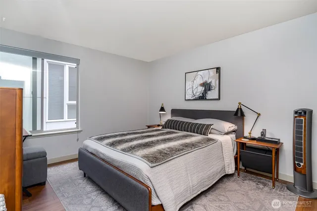 a bed room with a bed and a window