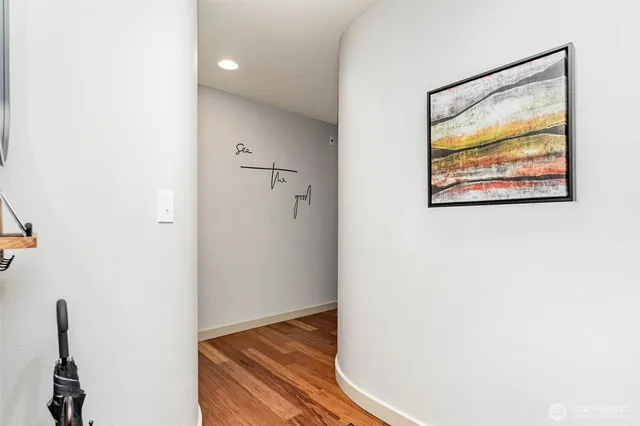 a view of room with wooden floor