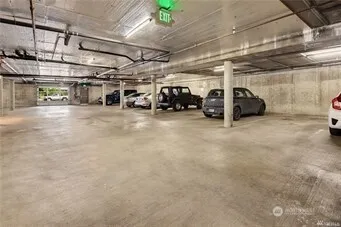 a view of parking garage with cars