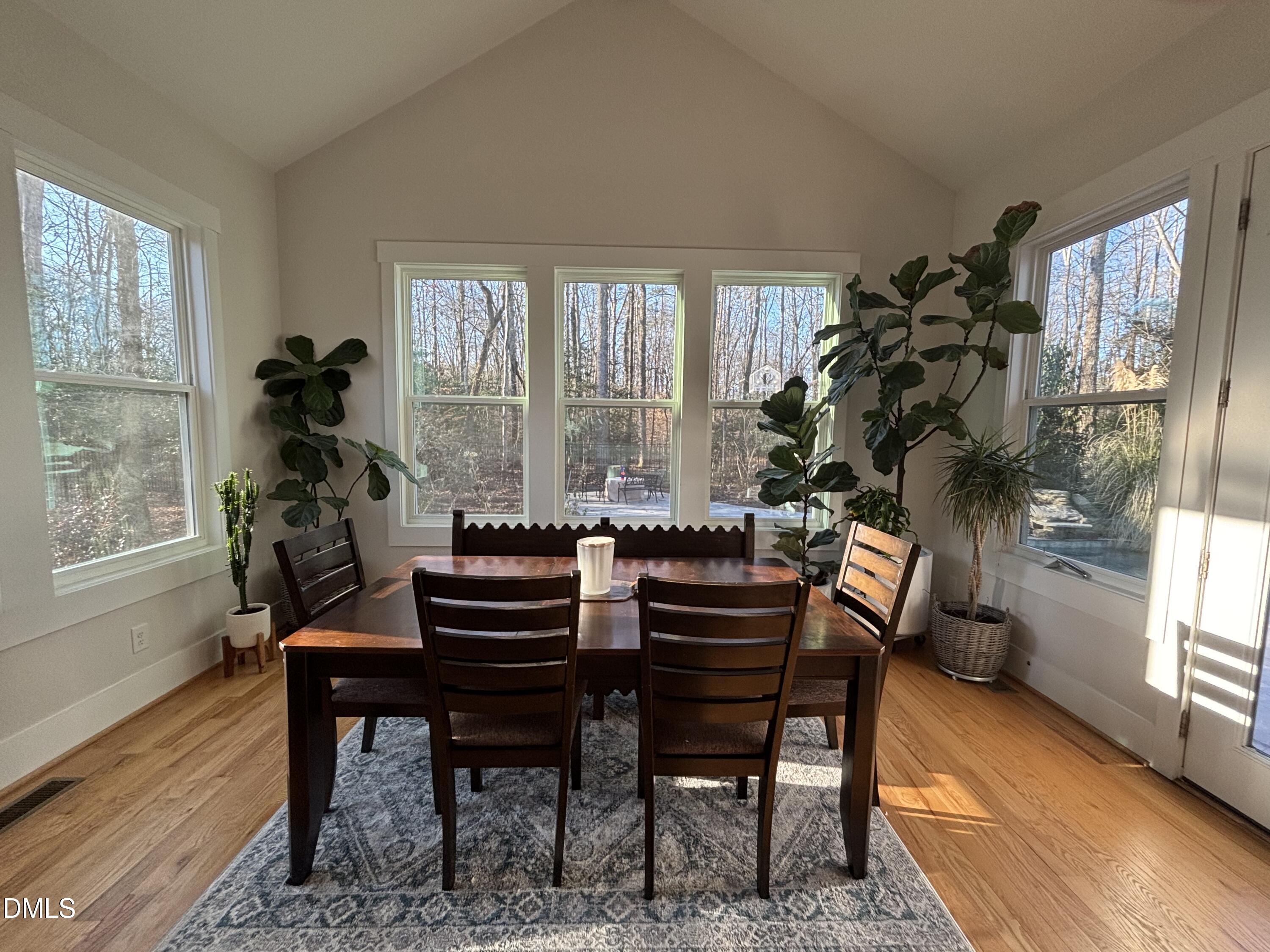 3939 River Stone Road Durham, NC 27705 - Photo 5 of 9 a living room with furniture a window and a potted plant