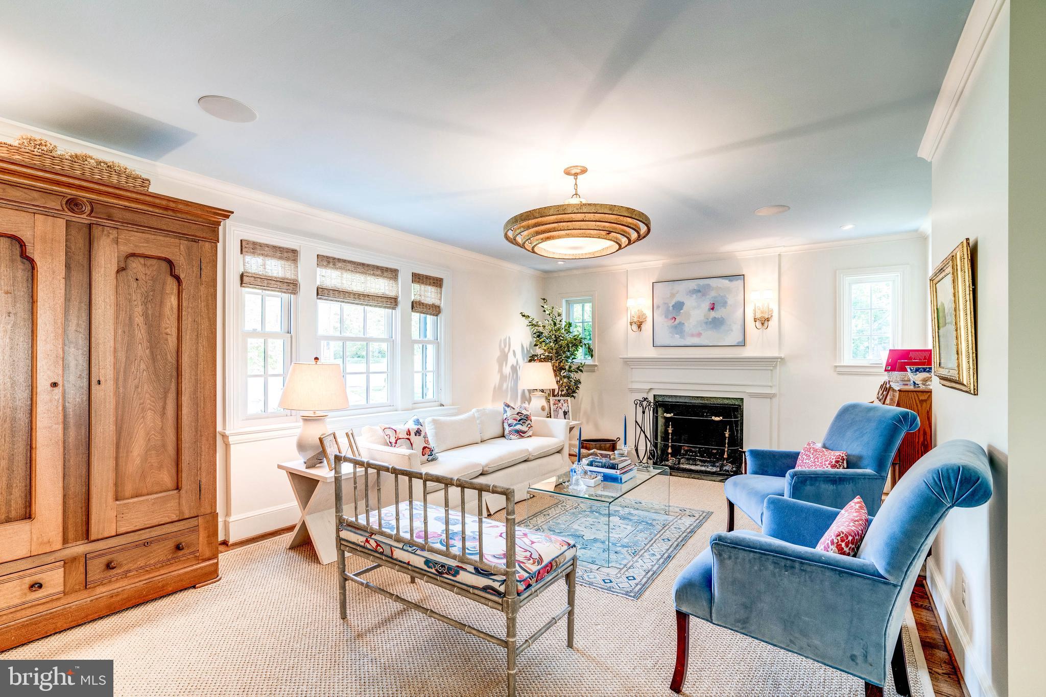 4509 Wetherill Road Bethesda, MD 20816 - Photo 12 of 89 a living room with furniture fireplace and a window