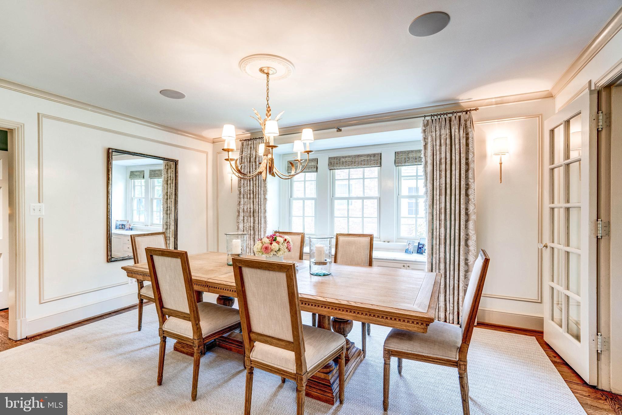 4509 Wetherill Road Bethesda, MD 20816 - Photo 18 of 89 a view of a dining room with furniture wooden floor and chandelier