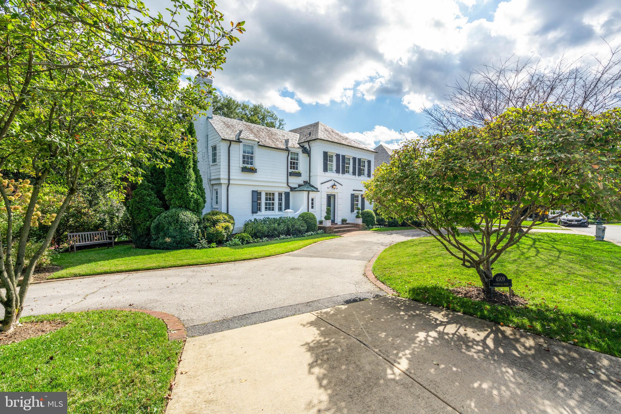 4509 Wetherill Road Bethesda, MD 20816 - Photo 2 of 89 a view of a garden with a building in the background