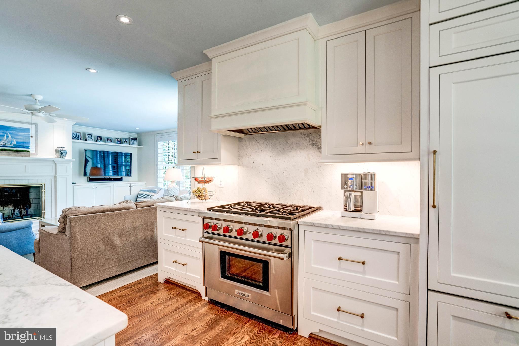 4509 Wetherill Road Bethesda, MD 20816 - Photo 26 of 89 a kitchen with stainless steel appliances granite countertop a stove and a white cabinets