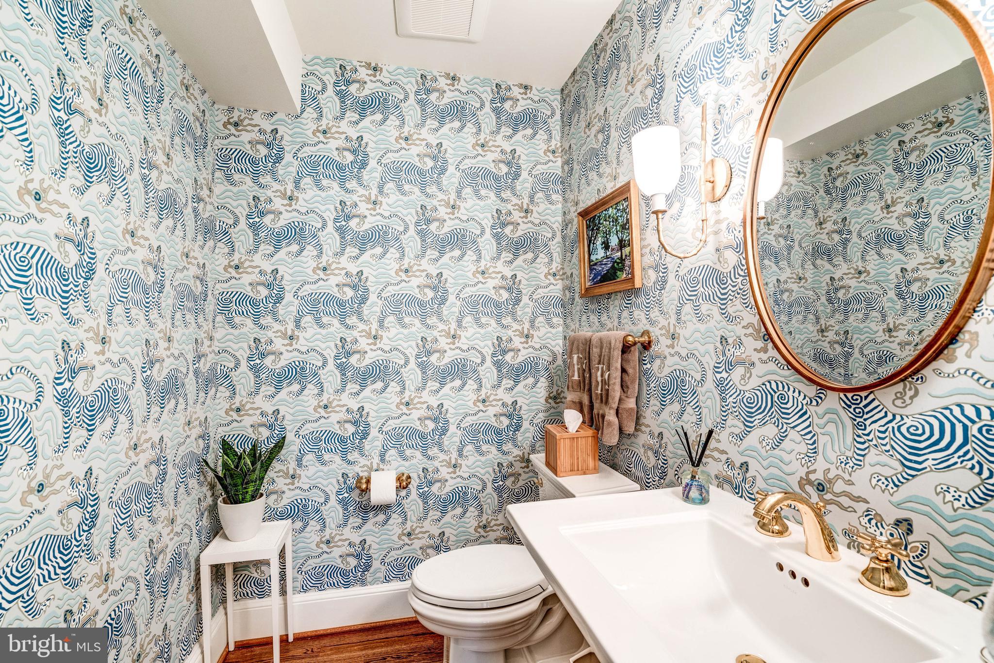 4509 Wetherill Road Bethesda, MD 20816 - Photo 35 of 89 a bathroom with a sink a toilet and a mirror