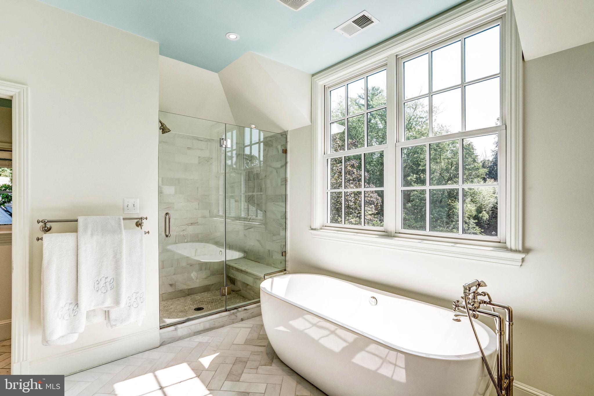 4509 Wetherill Road Bethesda, MD 20816 - Photo 50 of 89 a bathroom with a tub and shower