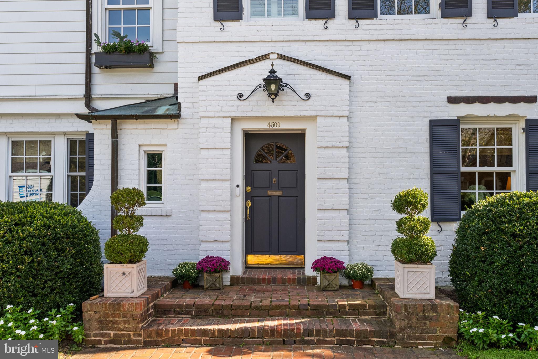 4509 Wetherill Road Bethesda, MD 20816 - Photo 5 of 89 a front view of a house with potted plants
