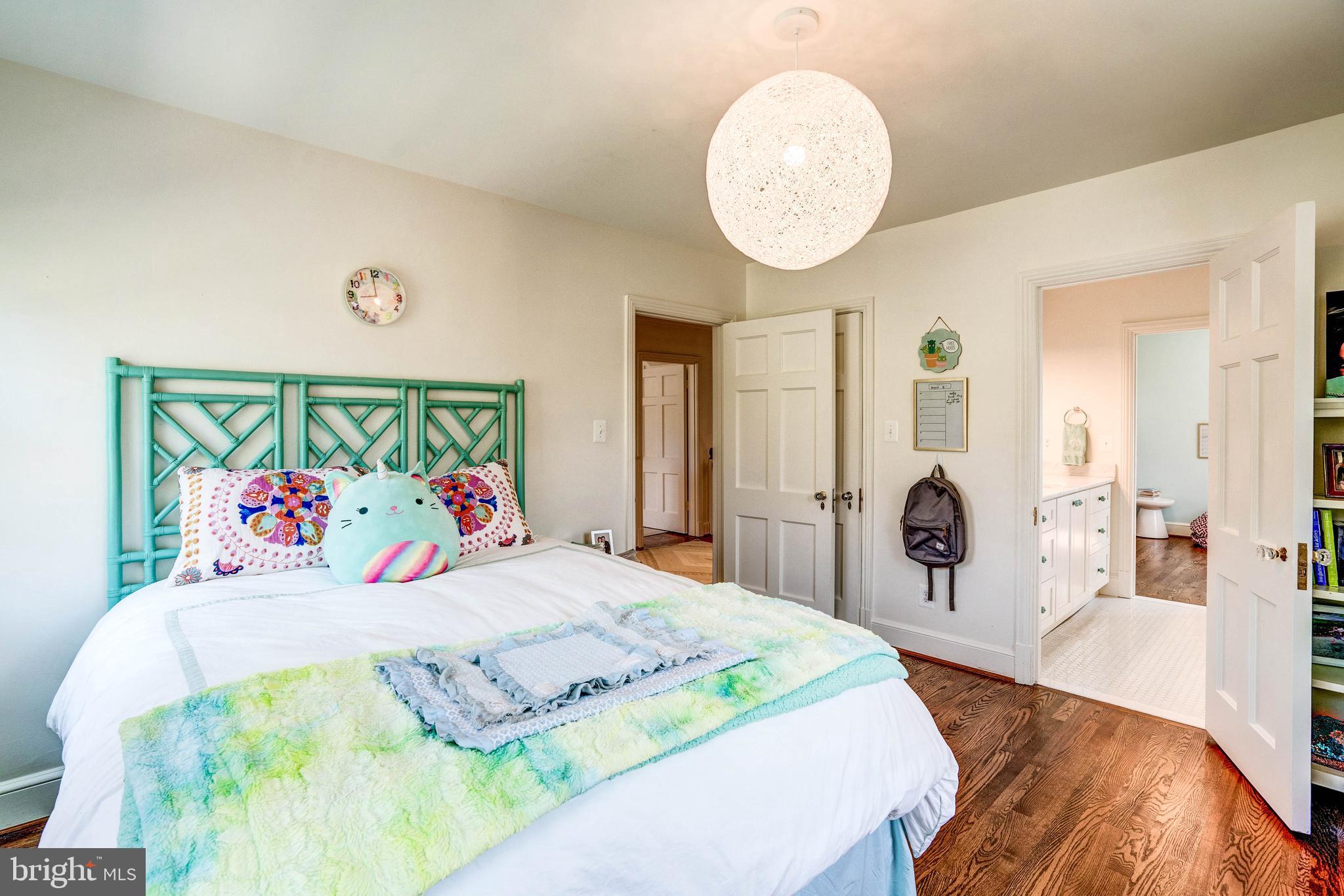 4509 Wetherill Road Bethesda, MD 20816 - Photo 60 of 89 a bedroom with a bed and a painting on the wall