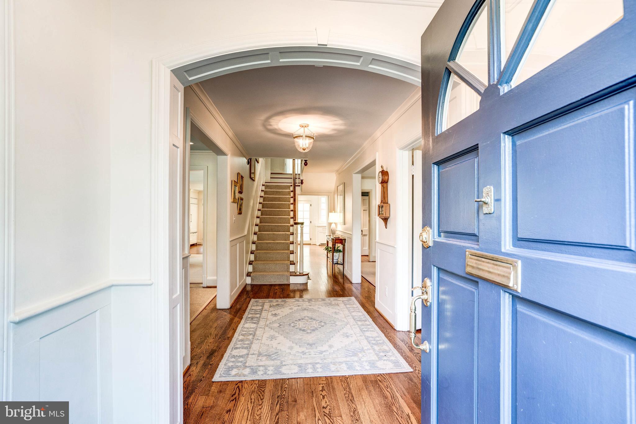 4509 Wetherill Road Bethesda, MD 20816 - Photo 6 of 89 a view of a hallway with wooden floor and staircase