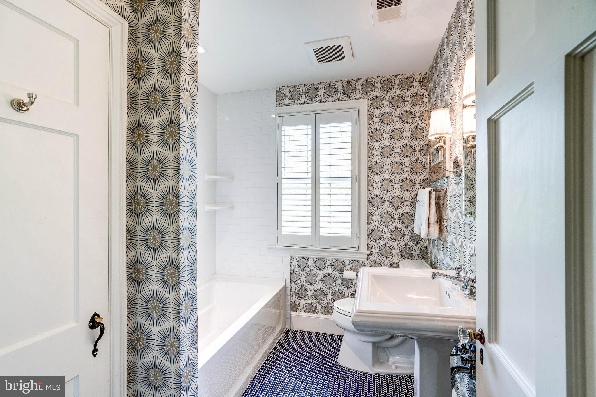 4509 Wetherill Road Bethesda, MD 20816 - Photo 65 of 89 a bathroom with a bathtub shower sink and a toilet