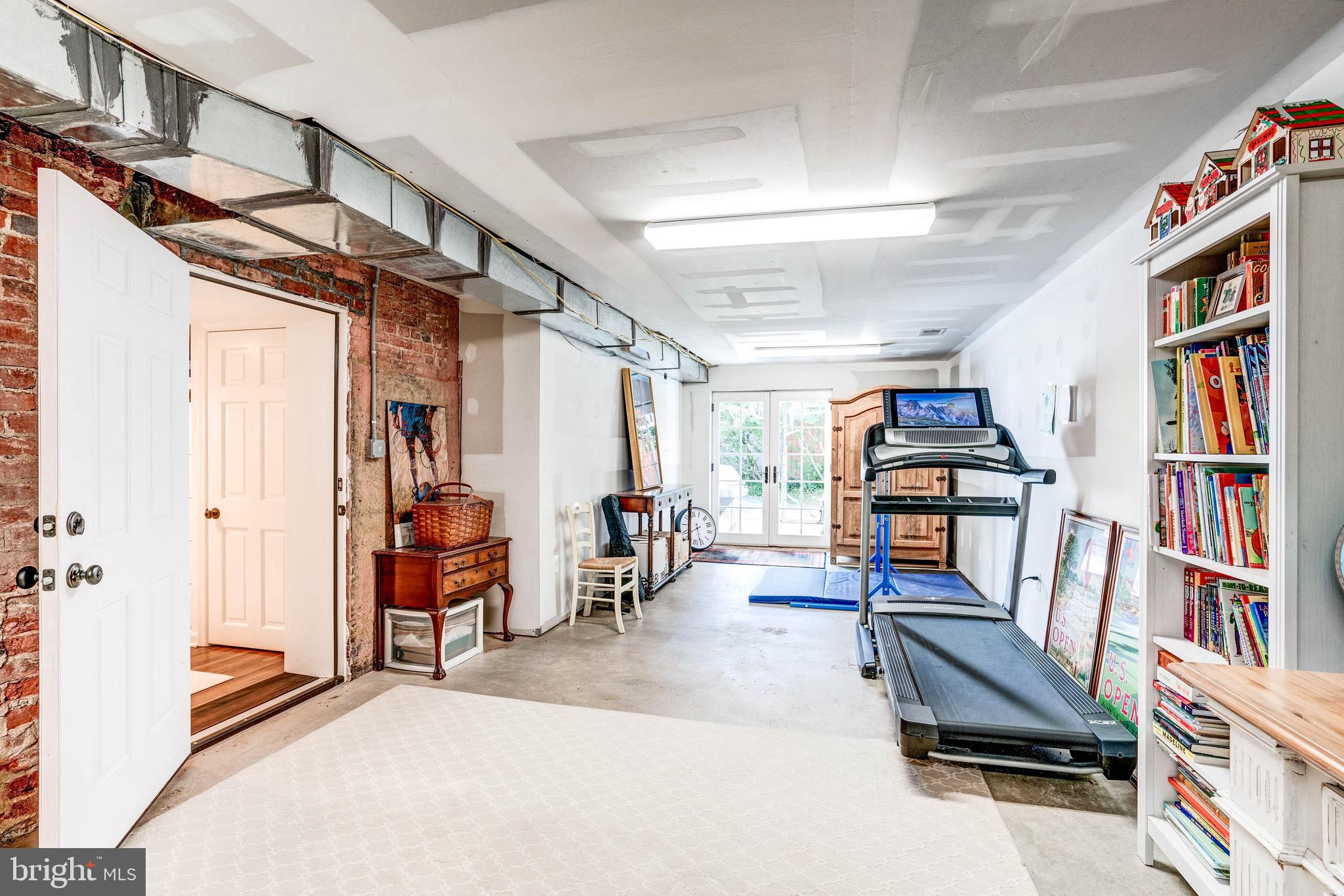 4509 Wetherill Road Bethesda, MD 20816 - Photo 74 of 89 a living room with furniture and a book shelf