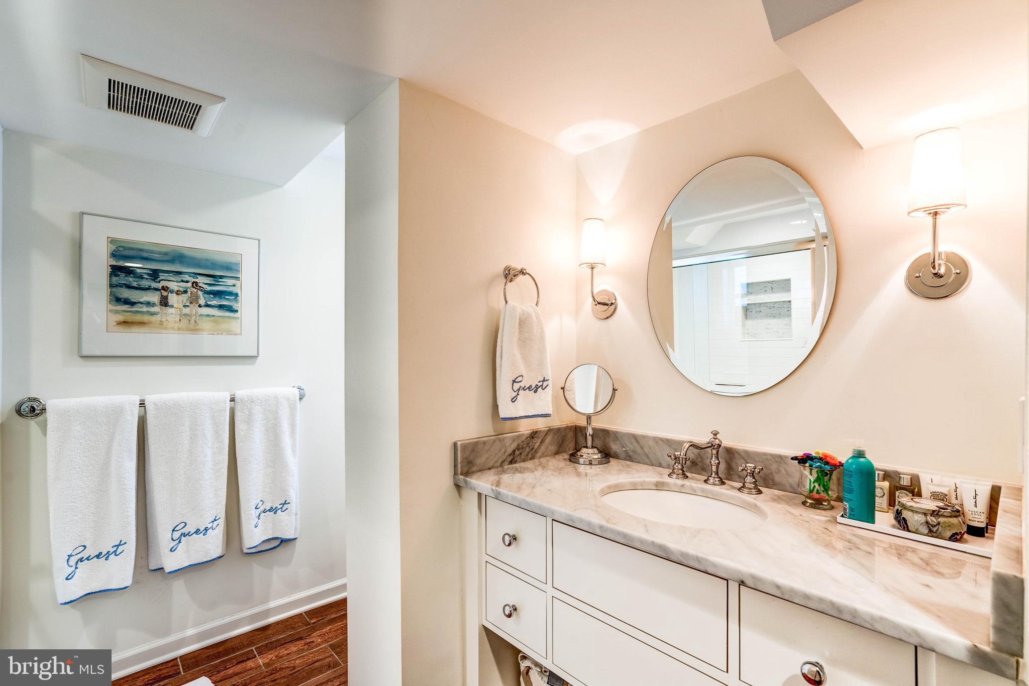4509 Wetherill Road Bethesda, MD 20816 - Photo 78 of 89 a bathroom with a granite countertop double vanity sinks and a mirror