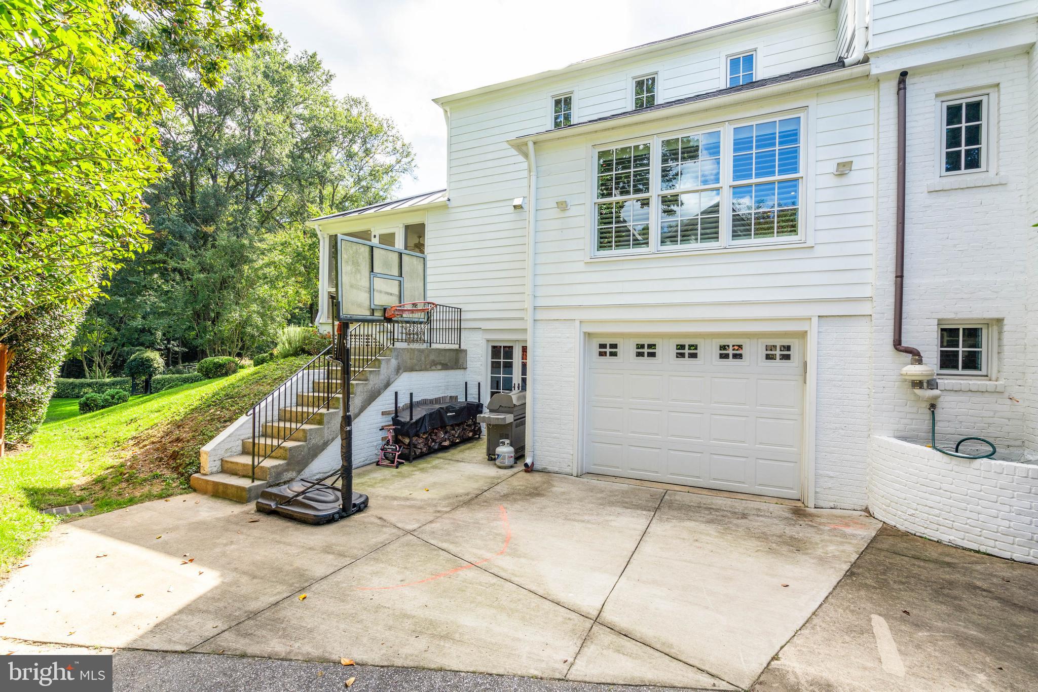 4509 Wetherill Road Bethesda, MD 20816 - Photo 83 of 89 a view of a chair and table in backyard of the house