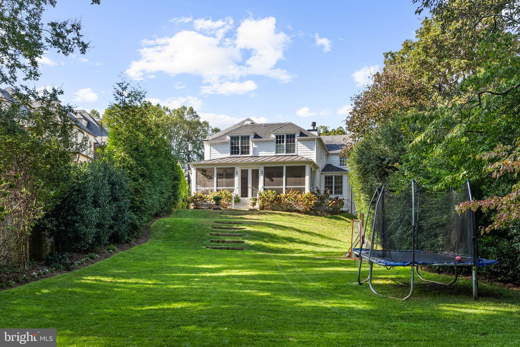 4509 Wetherill Road Bethesda, MD 20816 - Photo 88 of 89 a front view of a house with a yard table and chairs