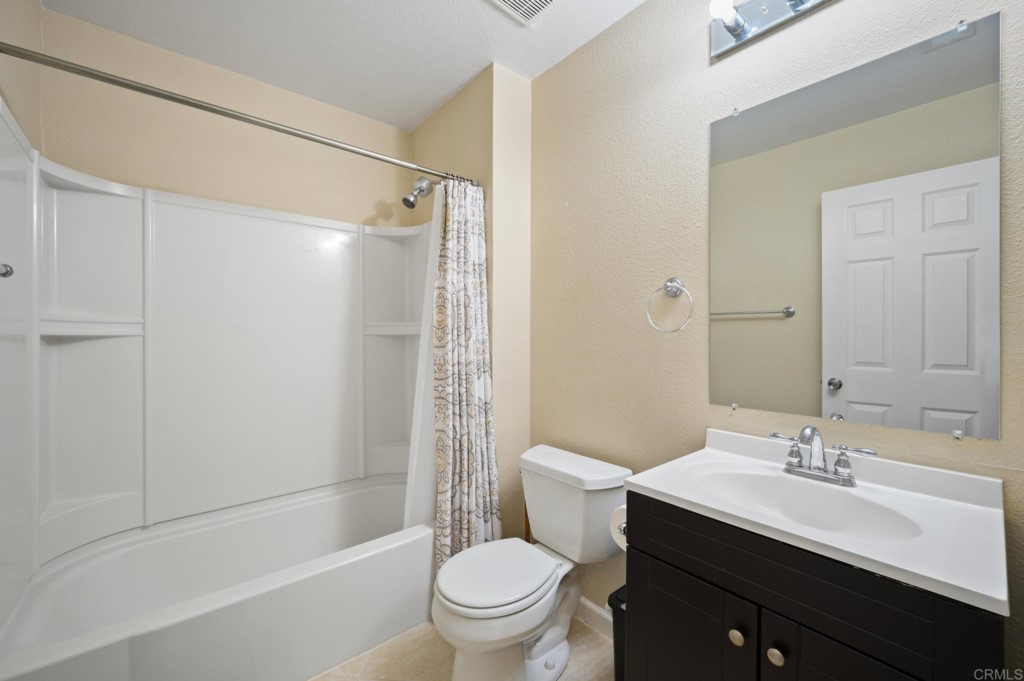 228 Ocotillo Place Oceanside, CA 92057 - Photo 16 of 31 a bathroom with a sink a toilet and shower