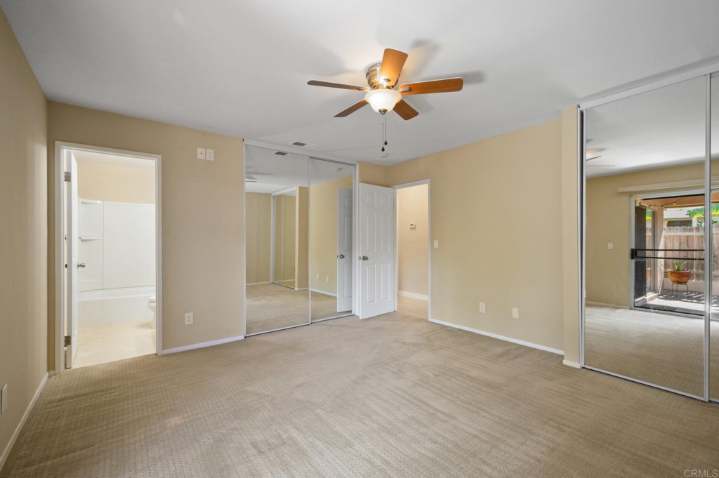 228 Ocotillo Place Oceanside, CA 92057 - Photo 19 of 31 a view of an empty room with a ceiling fan