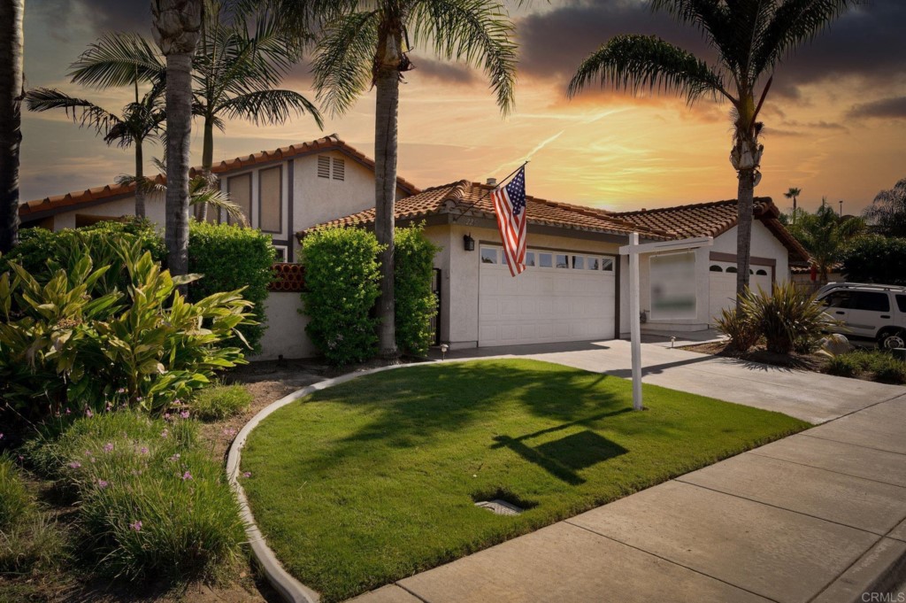 228 Ocotillo Place Oceanside, CA 92057 - Photo 2 of 31 a house with palm tree next to a yard