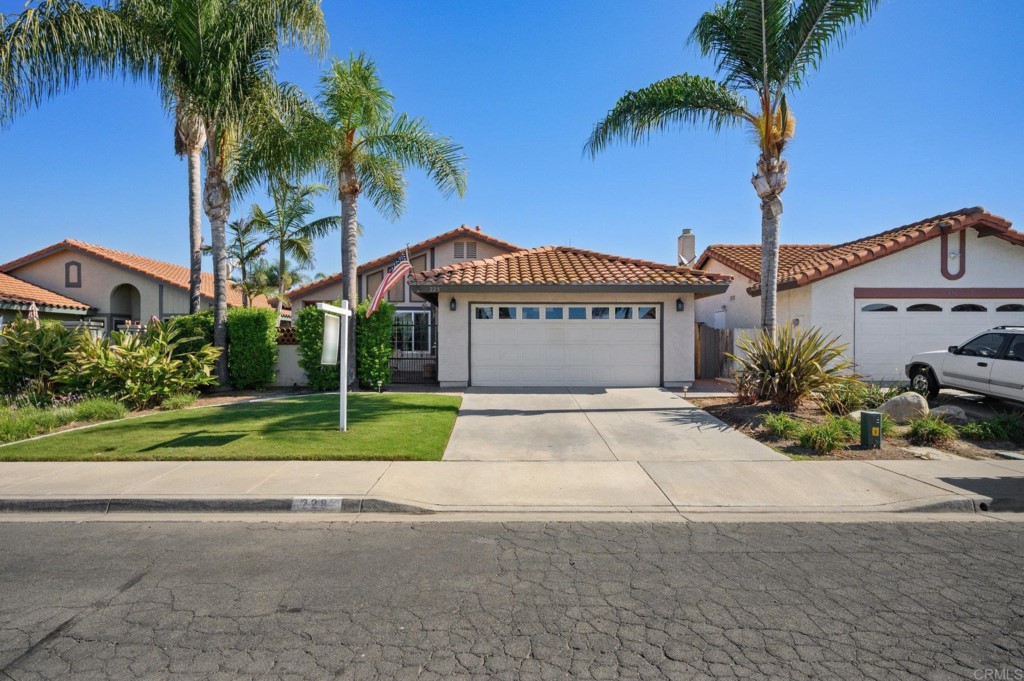 228 Ocotillo Place Oceanside, CA 92057 - Photo 30 of 31 a view of a house with a yard and palm trees