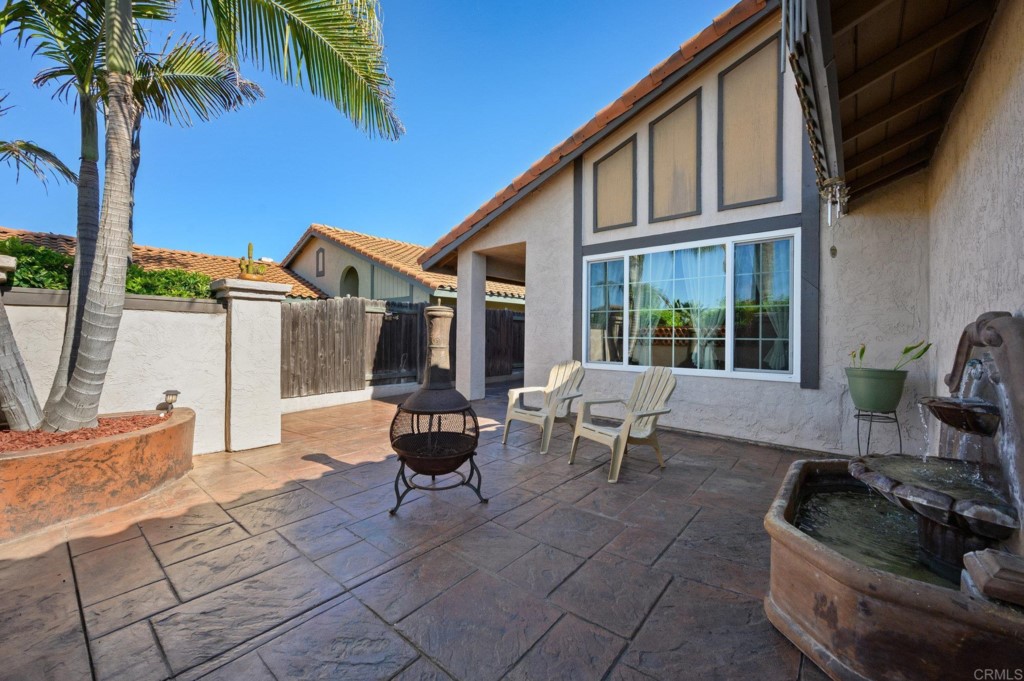 228 Ocotillo Place Oceanside, CA 92057 - Photo 4 of 31 a backyard of a house with seating space