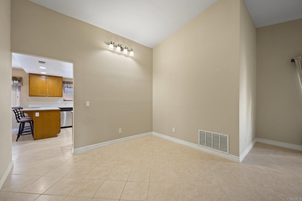 228 Ocotillo Place Oceanside, CA 92057 - Photo 8 of 31 a view of a livingroom with wooden floor and a bathroom