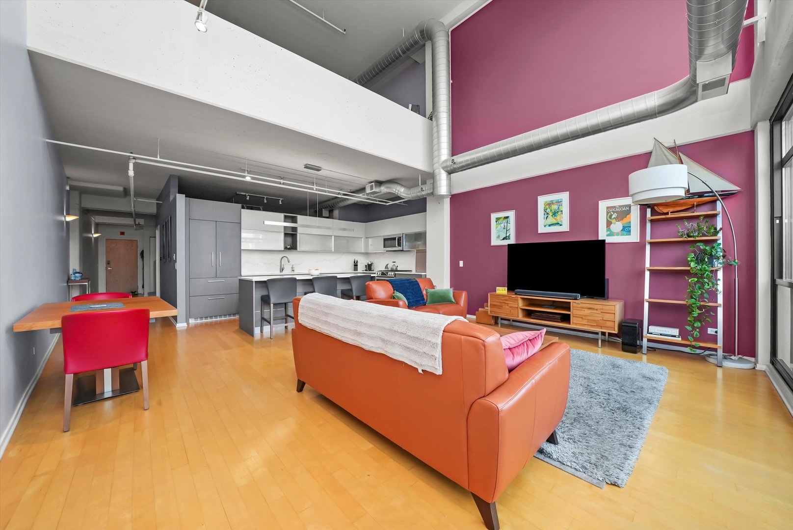 1530 South State Street, Unit 1004 Chicago, IL 60605 - Photo 7 of 38 a living room with furniture and a flat screen tv