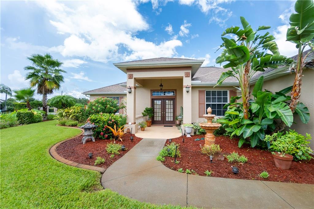 One owner Custom built home with GORGEOUS LANDSCAPING and HUGE OVERSIZED 3 CAR GARAGE!