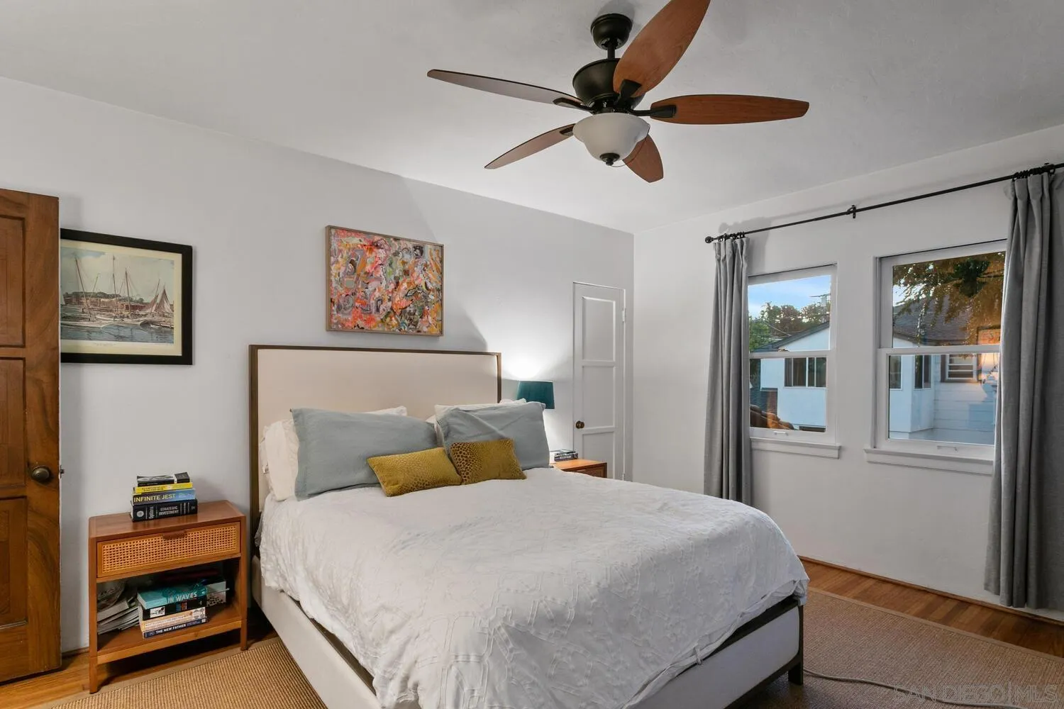 3443 Freeman Street San Diego, CA 92106 - Photo 12 of 35 a bedroom with a large bed and a window