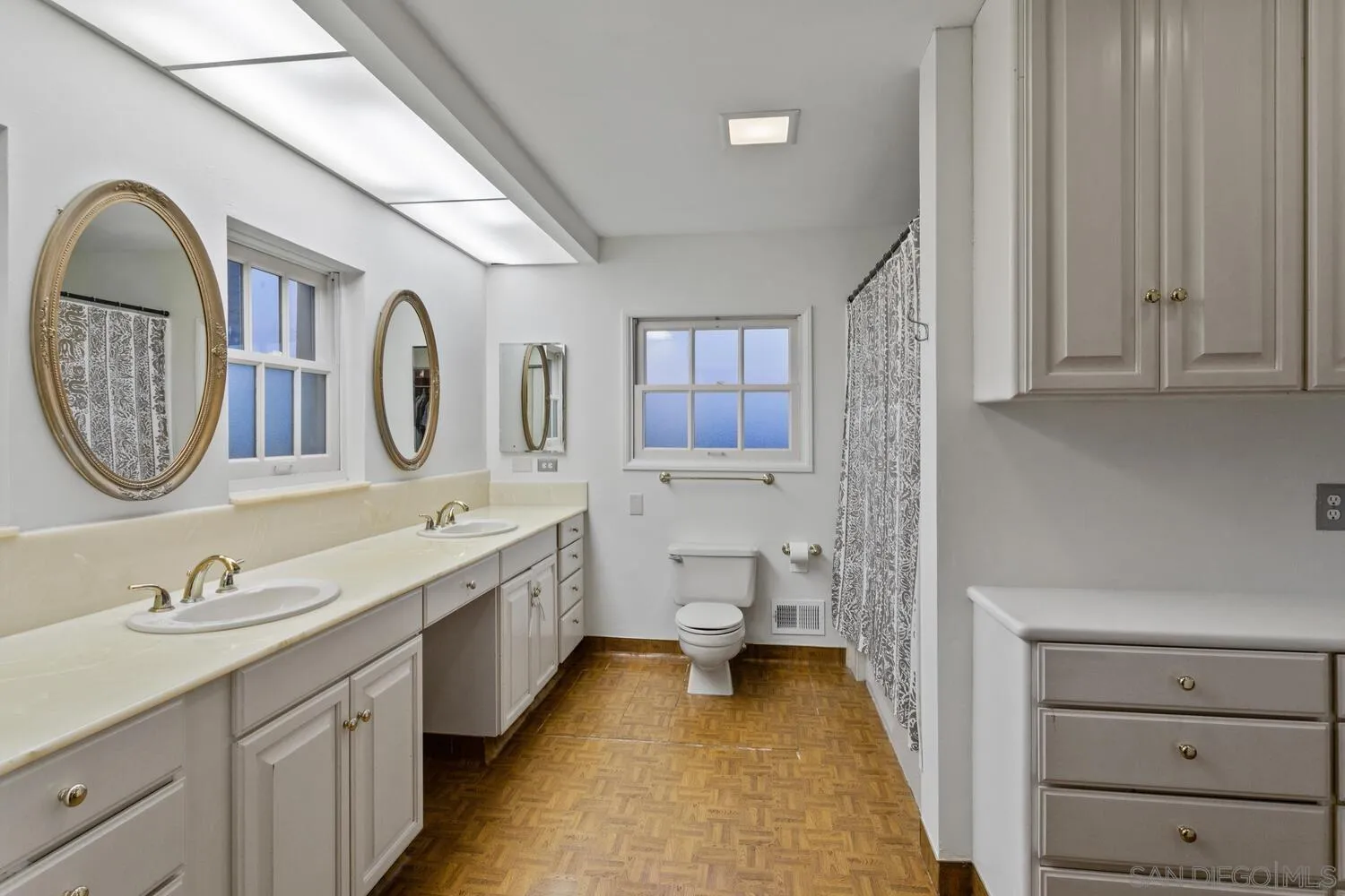 3443 Freeman Street San Diego, CA 92106 - Photo 14 of 35 a bathroom with a double vanity sink mirror and bathtub