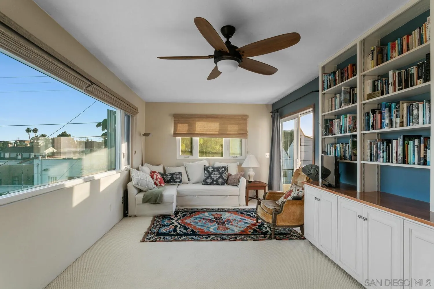 3443 Freeman Street San Diego, CA 92106 - Photo 21 of 35 a living room with furniture and a book shelf