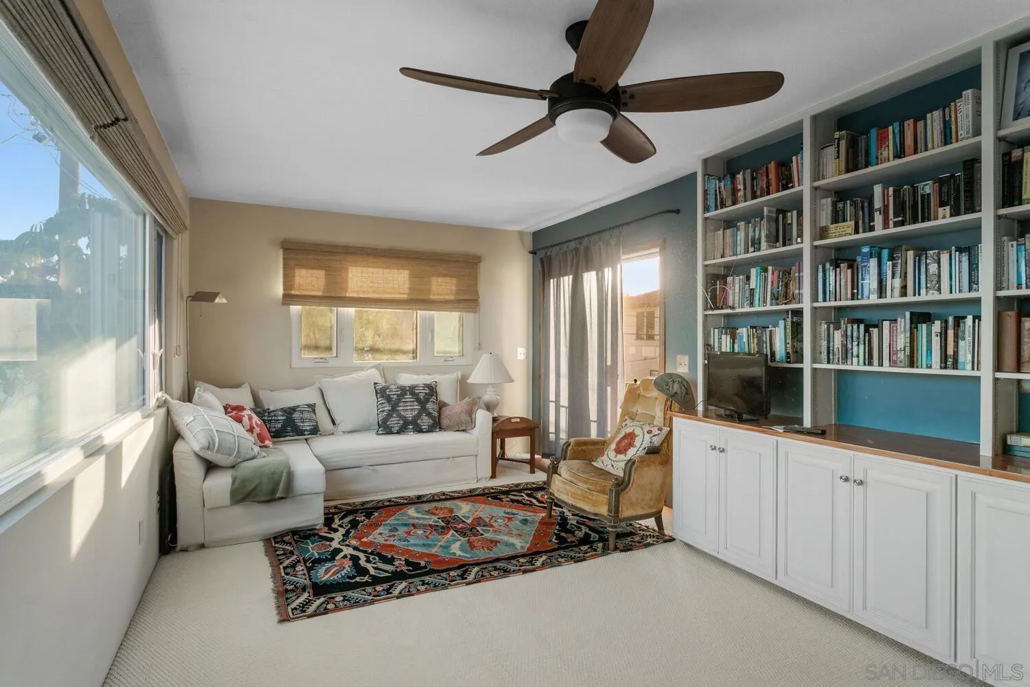 3443 Freeman Street San Diego, CA 92106 - Photo 23 of 35 a living room with furniture and a book shelf