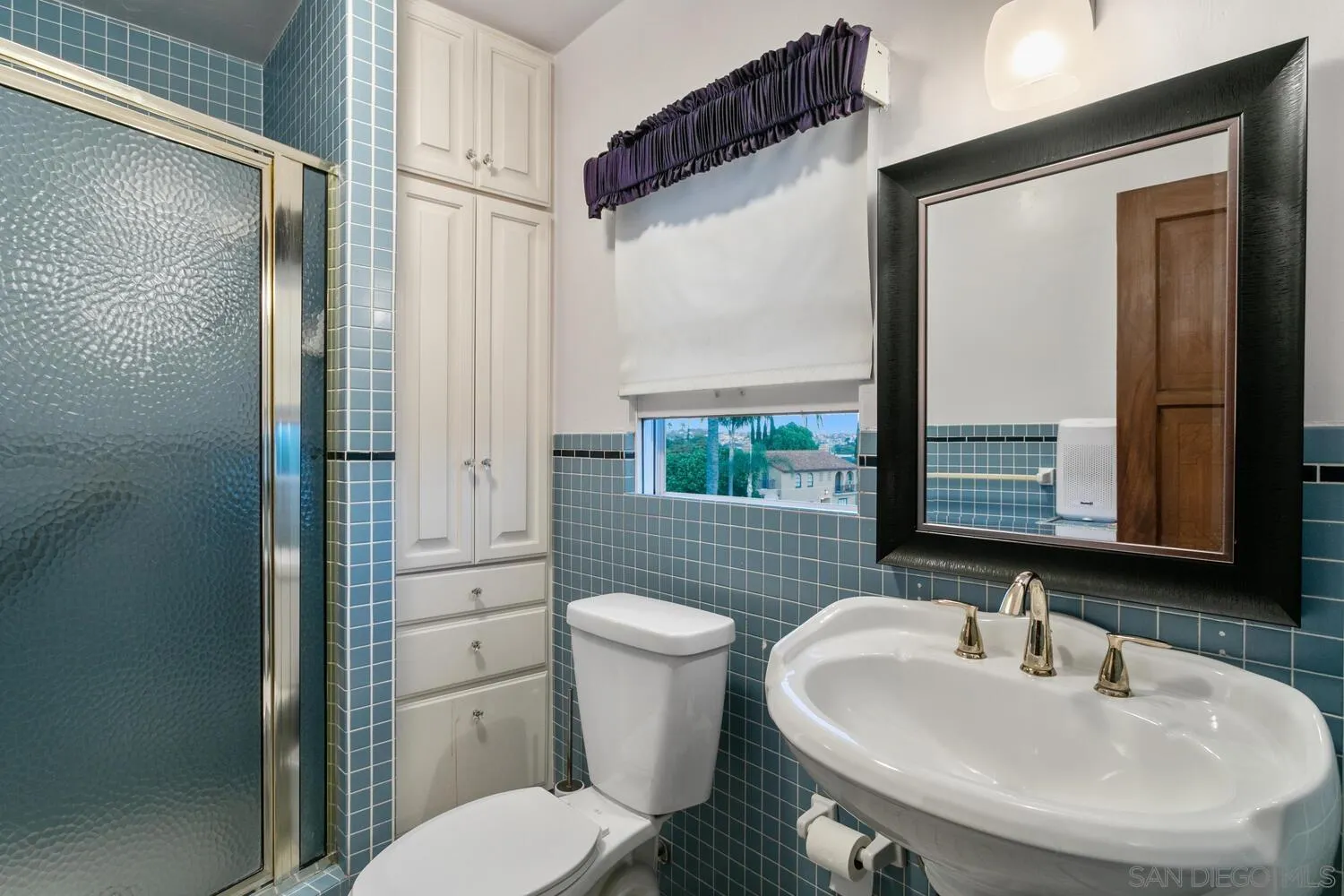 3443 Freeman Street San Diego, CA 92106 - Photo 28 of 35 a bathroom with a sink a toilet and shower