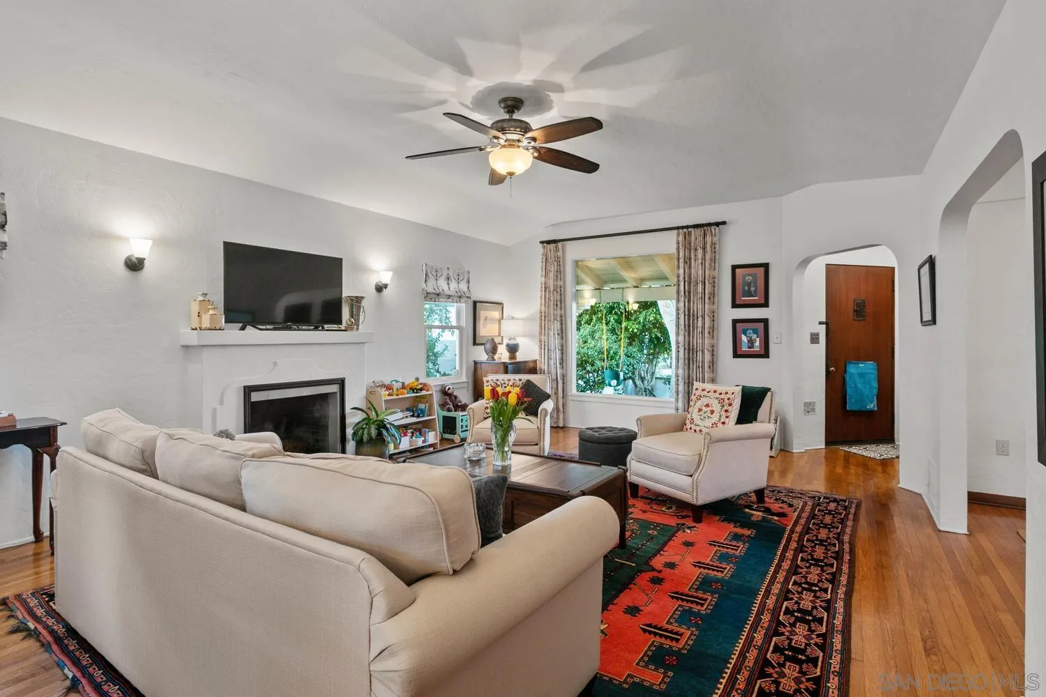 3443 Freeman Street San Diego, CA 92106 - Photo 5 of 35 a living room with furniture a fireplace and a flat screen tv